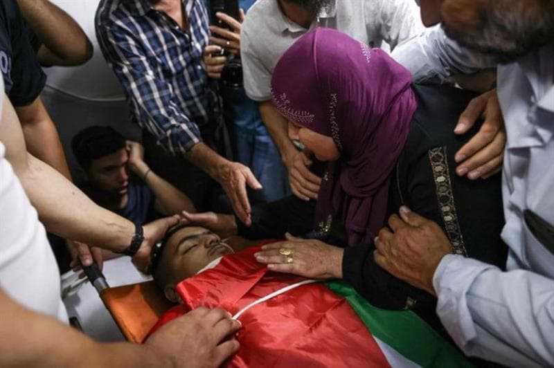 Israeli Snipers Kill Two Palestinian Youths During Settler Raid on Al-Mughayyir